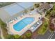 Inviting aerial view of the community pool area, featuring lounge chairs, tables, and a hot tub at 614 15Th Ave. S # 41, Surfside Beach, SC 29575