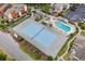 Aerial view highlighting a tennis court next to a pool and sunbathing deck for community recreation at 614 15Th Ave. S # 41, Surfside Beach, SC 29575