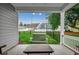 Relax on this peaceful back porch with a porch swing and view of the fenced in back yard at 620 Lorenzo Dr. # 620, North Myrtle Beach, SC 29582