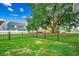 Large fenced in back yard with green grass and huge tree, perfect for Gathering gatherings at 620 Lorenzo Dr. # 620, North Myrtle Beach, SC 29582