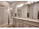 Modern bathroom with granite countertop, double sinks, and a glass-enclosed shower at 620 Lorenzo Dr. # 620, North Myrtle Beach, SC 29582