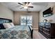 This carpeted bedroom has a large bed, dresser, and window that lets in plenty of natural light at 620 Lorenzo Dr. # 620, North Myrtle Beach, SC 29582