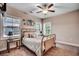 Bright bedroom with windows, carpeted floor, ceiling fan and neutral decor with beach themed decorations at 620 Lorenzo Dr. # 620, North Myrtle Beach, SC 29582