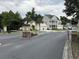View of the community entry gate with palm trees at 620 Lorenzo Dr. # 620, North Myrtle Beach, SC 29582