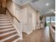 Hallway with wooden staircase, decor and access to the kitchen and living area at 620 Lorenzo Dr. # 620, North Myrtle Beach, SC 29582