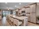 Spacious kitchen with a large granite island, stainless steel appliances, and ample cabinet space for storage at 620 Lorenzo Dr. # 620, North Myrtle Beach, SC 29582