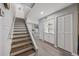 Entryway with beautiful staircase leading to the living room and kitchen area at 64 Bamboo Loop # 161, Georgetown, SC 29440