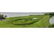 Large grassy green space with small ponds near the waterway at 64 Bamboo Loop # 161, Georgetown, SC 29440