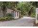 Exterior view of the community's guard house with security gate and lush greenery at 64 Bamboo Loop # 161, Georgetown, SC 29440