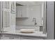 Close up of the bright kitchen pass-through featuring countertop and white cabinetry at 64 Bamboo Loop # 161, Georgetown, SC 29440