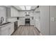 Updated kitchen with stainless steel appliances, granite counters, and hardwood floors at 64 Bamboo Loop # 161, Georgetown, SC 29440