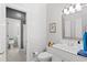 White bathroom featuring a toilet and standing sink at 6572 Wellington Dr., Murrells Inlet, SC 29576