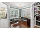 Bright breakfast nook features windows, a dining table with chairs, and access to the kitchen at 6572 Wellington Dr., Murrells Inlet, SC 29576
