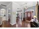 Elegant foyer with hardwood floors, decorative lighting, and arched doorways at 6572 Wellington Dr., Murrells Inlet, SC 29576