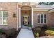 Charming brick home featuring an arched front entrance with decorative glass door at 6572 Wellington Dr., Murrells Inlet, SC 29576