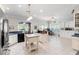 Bright eat-in kitchen boasts stainless steel appliances, a center island, and open access to a cozy sitting room at 6572 Wellington Dr., Murrells Inlet, SC 29576