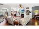 Spacious living room featuring a fireplace, a ceiling fan, and an open layout at 6572 Wellington Dr., Murrells Inlet, SC 29576