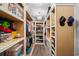 Spacious walk-in closet with custom shelving and ample storage for clothes and accessories at 6572 Wellington Dr., Murrells Inlet, SC 29576