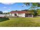 Well-maintained backyard with a deck, screened-in porch, and lush green lawn for outdoor enjoyment at 6593 Sunshine St. Nw, Ocean Isle Beach, NC 28469
