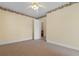 Neutral bedroom with two windows, neutral carpet, ceiling fan, and access to a closet at 6593 Sunshine St. Nw, Ocean Isle Beach, NC 28469