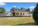 Inviting home exterior showcasing a covered front porch, ideal for relaxation and enjoying the serene surroundings at 6593 Sunshine St. Nw, Ocean Isle Beach, NC 28469