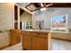 Bright eat-in kitchen featuring light wood cabinets, tiled floors, and view to an adjacent room at 6593 Sunshine St. Nw, Ocean Isle Beach, NC 28469