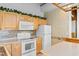 Well-equipped kitchen with wooden cabinetry, modern appliances, and ample counter space at 6593 Sunshine St. Nw, Ocean Isle Beach, NC 28469