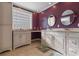 Spacious main bathroom with double vanities, recessed lights, tiled floors, and glass block window at 6593 Sunshine St. Nw, Ocean Isle Beach, NC 28469