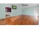 Large main bedroom featuring wood floors, light blue walls, recessed lights and a view to the main bath at 6593 Sunshine St. Nw, Ocean Isle Beach, NC 28469