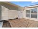 Rear patio with brick pavers, a window, and side entrance at 6593 Sunshine St. Nw, Ocean Isle Beach, NC 28469