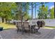 Charming backyard patio with an outdoor dining set and built-in grill at 6593 Sunshine St. Nw, Ocean Isle Beach, NC 28469