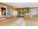 Bright sunroom with wood paneling, tile floor, and lots of natural light from sliding doors and windows at 6593 Sunshine St. Nw, Ocean Isle Beach, NC 28469