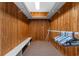 Large walk-in cedar closet with built-in bench and closet organization system at 6593 Sunshine St. Nw, Ocean Isle Beach, NC 28469