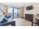 Cozy living room with oceanfront balcony access, offering breathtaking views and plenty of natural light at 6900 North Ocean Blvd. # 938, Myrtle Beach, SC 29572