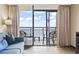 Enjoy ocean views from the living room's private balcony, perfect for relaxation and outdoor dining at 6900 North Ocean Blvd. # 938, Myrtle Beach, SC 29572