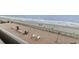 Breathtaking beach views from balcony with oceanfront access, complete with chairs and tables at 6900 North Ocean Blvd. # 938, Myrtle Beach, SC 29572