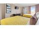 Well-appointed bedroom with two cozy beds, flat-screen TV, and a view of the ocean at 6900 North Ocean Blvd. # 938, Myrtle Beach, SC 29572