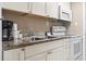 Modern kitchen features stainless steel appliances, ample counter space, and white cabinetry at 6900 North Ocean Blvd. # 938, Myrtle Beach, SC 29572