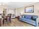 This living area is complete with a dining table, seating, a TV, and an open floorplan at 6900 North Ocean Blvd. # 938, Myrtle Beach, SC 29572