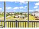 Relaxing balcony view showcasing the community pool, lush landscaping, and neighborhood in a serene setting at 701 Salleyport Dr. # 1117, Myrtle Beach, SC 29579