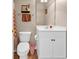 Bathroom with a white vanity, toilet, and decor accents for a welcoming atmosphere at 701 Salleyport Dr. # 1117, Myrtle Beach, SC 29579