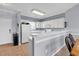 Well-lit kitchen area with a breakfast bar, white appliances, and ample cabinetry at 701 Salleyport Dr. # 1117, Myrtle Beach, SC 29579