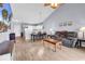 Spacious living room adjacent to the kitchen, featuring hardwood floors and cozy furniture at 701 Salleyport Dr. # 1117, Myrtle Beach, SC 29579