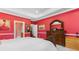 Bedroom with vibrant walls, wooden furniture, and plenty of natural light at 702 Compass Point Dr., North Myrtle Beach, SC 29582