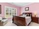 Bedroom with a large window and wooden furniture pieces at 702 Compass Point Dr., North Myrtle Beach, SC 29582