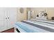 Bedroom showing a queen-sized bed and hardwood floors at 702 Compass Point Dr., North Myrtle Beach, SC 29582