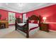 This bedroom features a large bed, ample natural light, and classic decor at 702 Compass Point Dr., North Myrtle Beach, SC 29582
