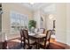 A formal dining area with wood table, seating for six, and elegant decor in neutral color palette at 702 Compass Point Dr., North Myrtle Beach, SC 29582