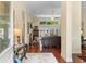 Welcoming entryway leading into a spacious living area with hardwood floors, neutral paint, and lots of natural light at 702 Compass Point Dr., North Myrtle Beach, SC 29582
