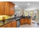 Spacious kitchen with granite counters and stainless steel appliances overlooking the dining area at 702 Compass Point Dr., North Myrtle Beach, SC 29582